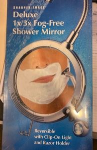 Sharper image fog free shower mirror
